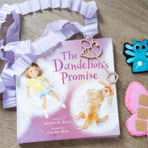 Puppet & Promise Pack including The Dandelion’s Promise hardcover book, a handmade felt finger puppet, and an eco bubble wand for mindful storytelling and play.