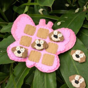 Handmade felt Tic Tac Toe board game with handmade dog and bee pieces, eco-friendly and perfect for kids’ sensory and mindfulness play.